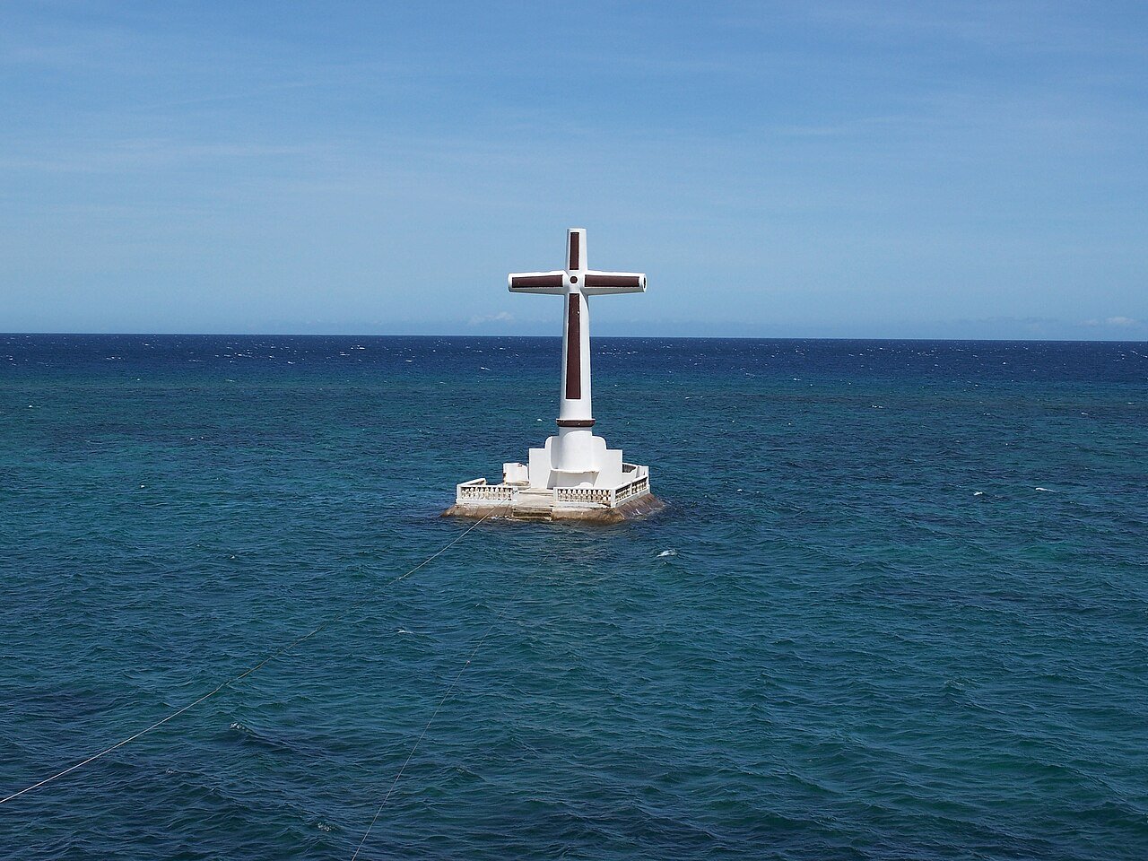 The cross marker at the Sunken Cemetery in Camiguin at dusk