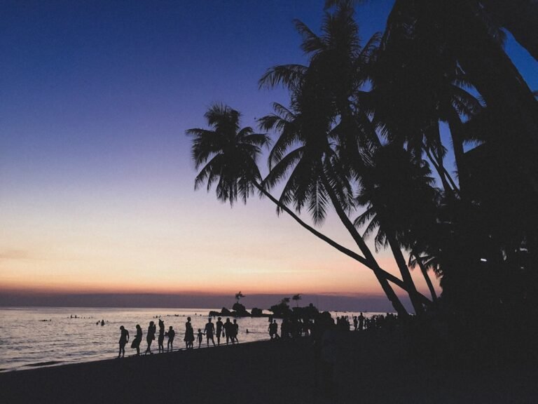 Boracay travel guide, sunset over White Beach with paraw sailboats