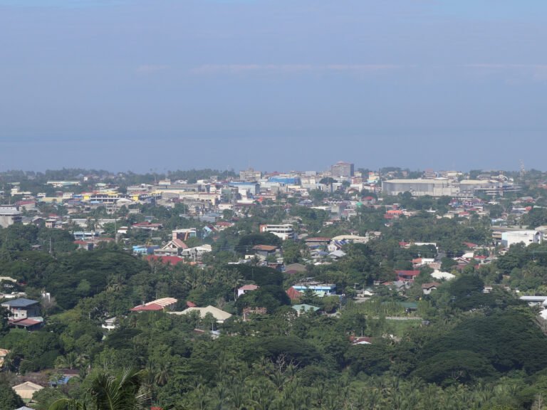 Iligan City skyline overlooking Mount Lelong, a starting point for things to do in Iligan