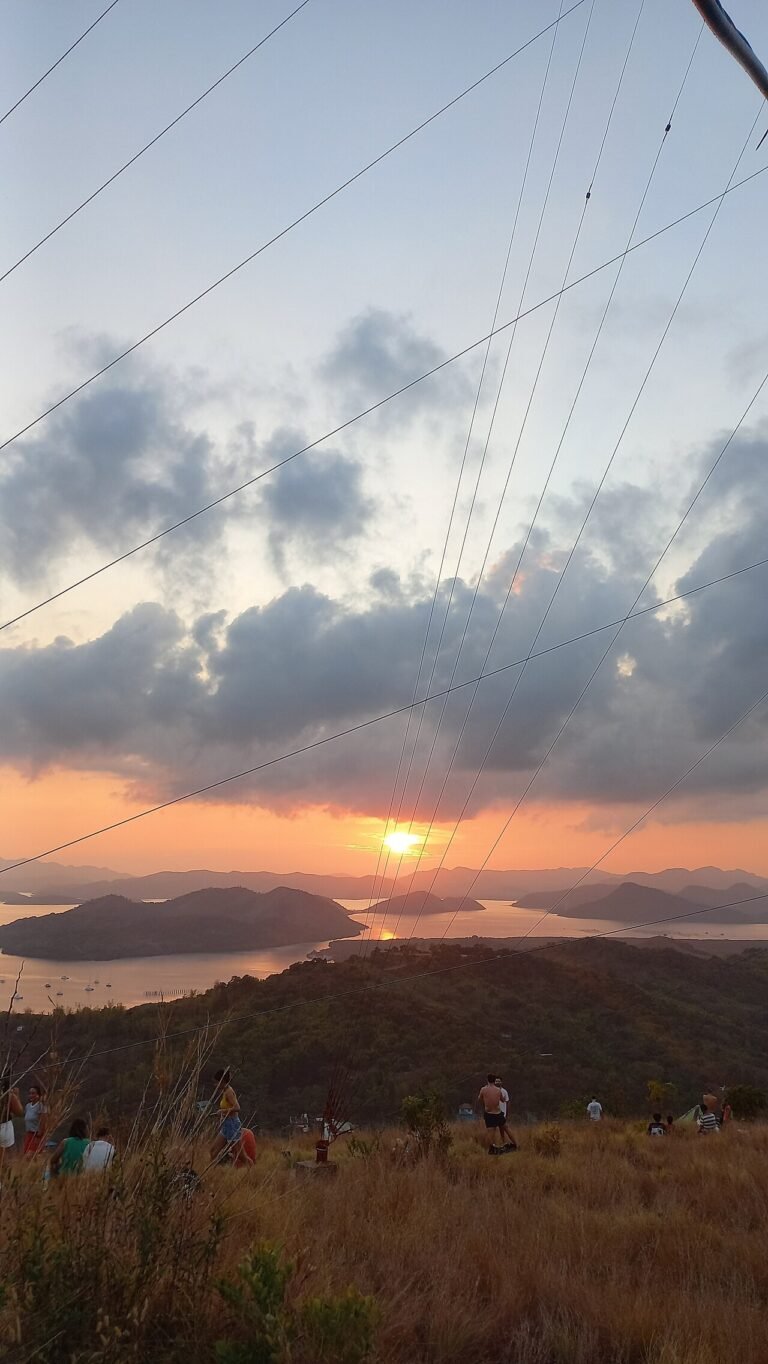 Island camping in Coron, sunset over the Calamian islands