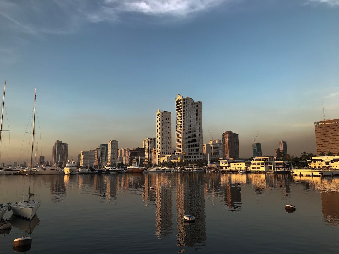Where to stay in Manila, the city skyline seen across Manila Bay