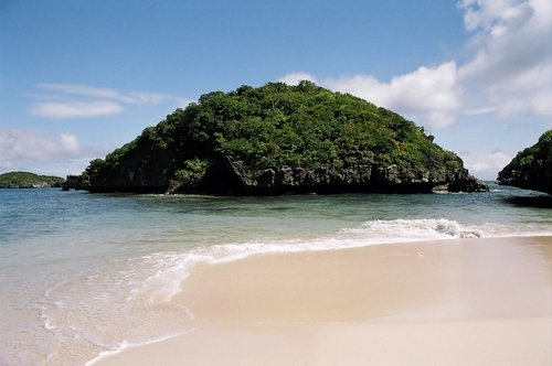 Hundred Islands National Park seen from the water near Alaminos City